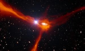 Науковці з обсерваторії ESO спостерігали за далекою галактикою під час її «трапези»