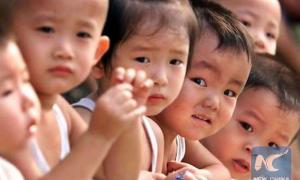 Китайців до народження дітей стимулюватимуть грішми